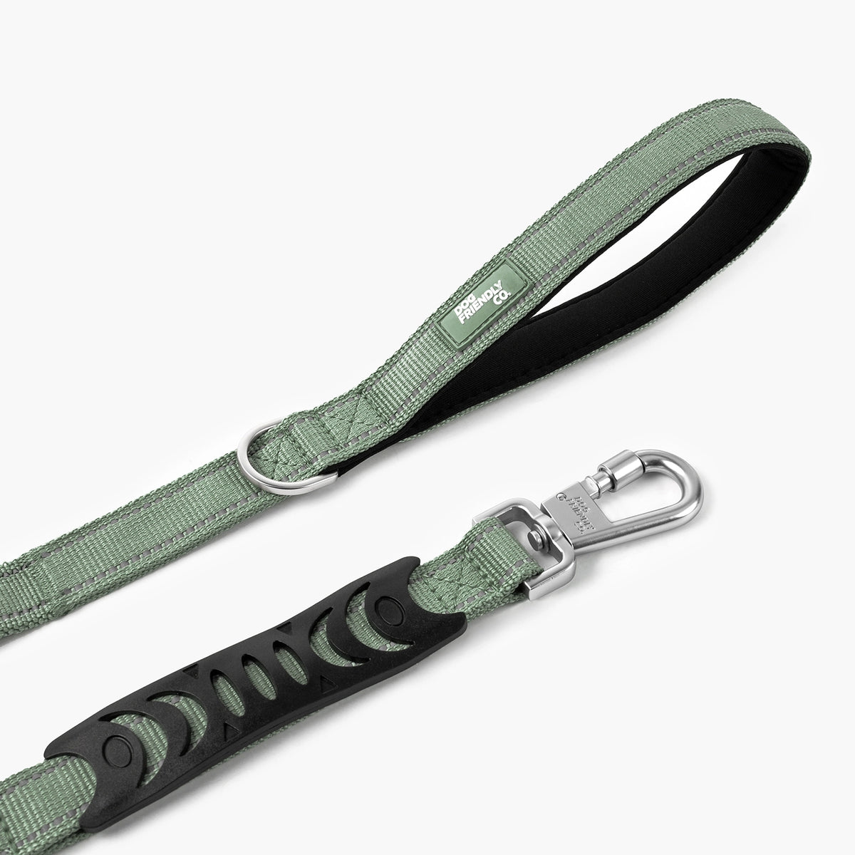 Close-up of the premium khaki bungee dog leash showing the padded handle, metal D-ring and heavy-duty clip.