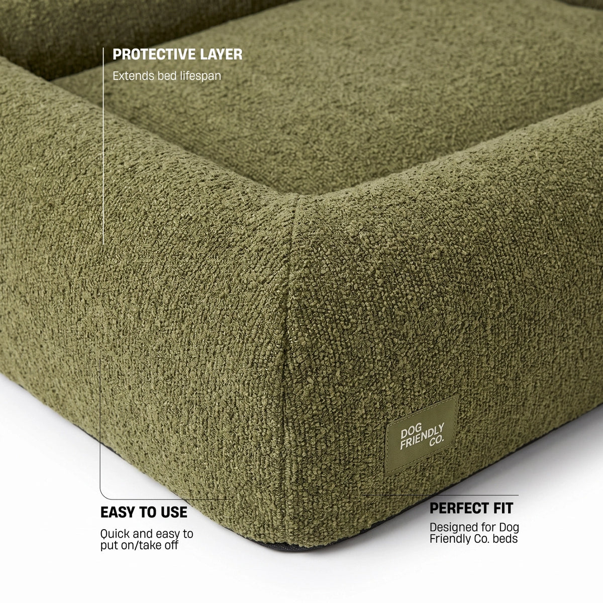 Green bouclé replacement cover highlighting easy removal, soft lining, machine washing, and protection for the original bed cover.